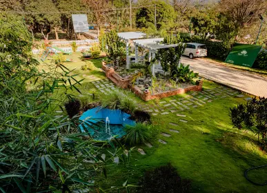 Home Nature-focused community space surrounded by greenery at Anugraha Farms