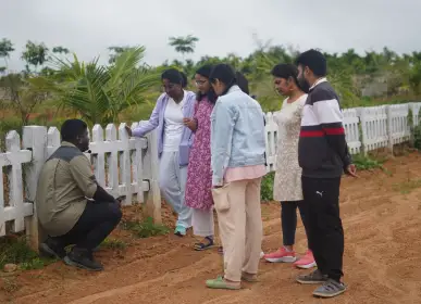 Home Visitors observing the farm during a field learning session