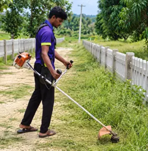 Field maintenance work being carried out at Anugraha Farms