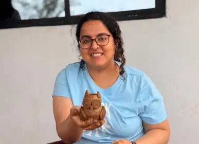 Visitor taking part in a pottery experience at Anugraha Farms