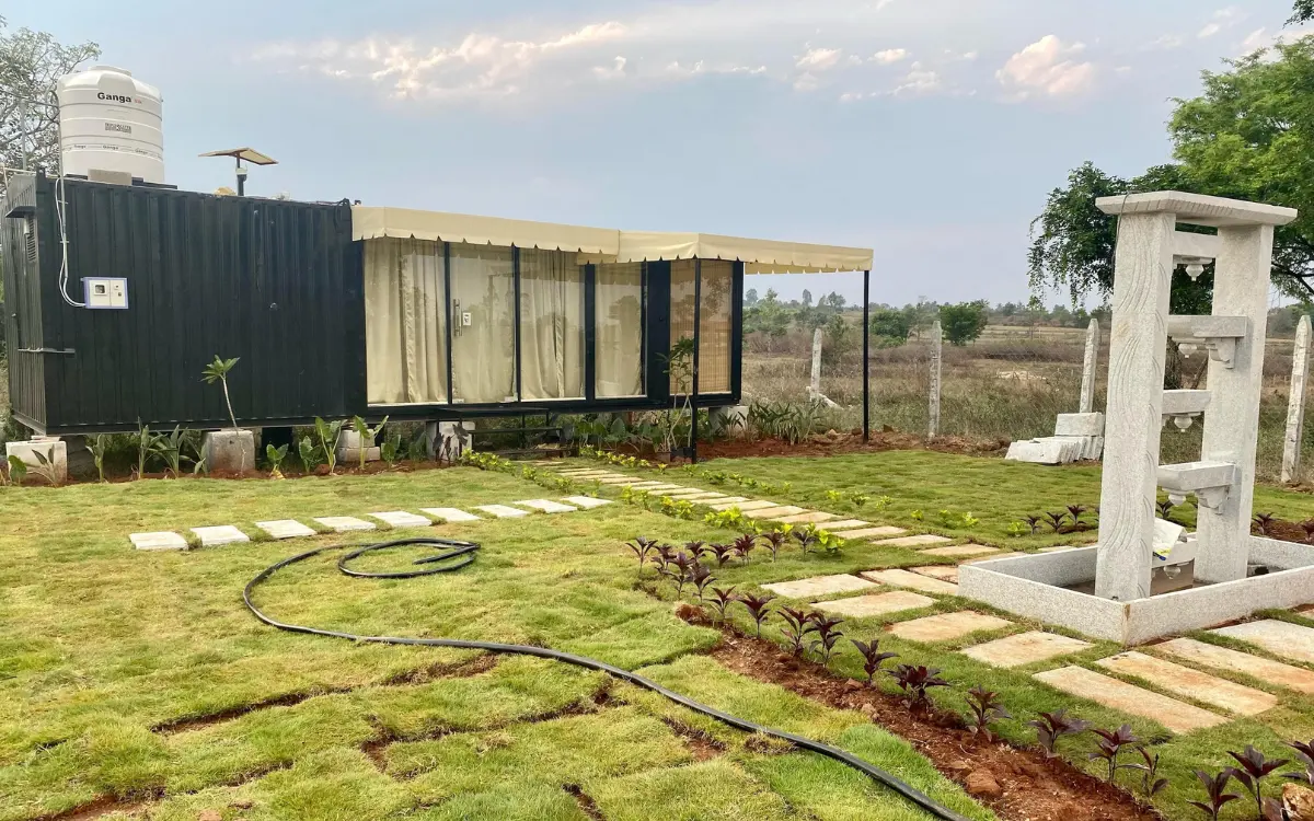 Farmhouse and landscaped surroundings at Sangam Farms in Thally